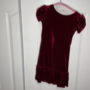 Chic Red Girls Dress with Black Trim and Pockets Perfect for Any Occasion!